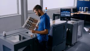 Man Checking a Sheet of Labels