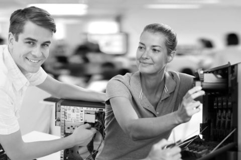 Teacher And Trainee Technician Repairing Printer