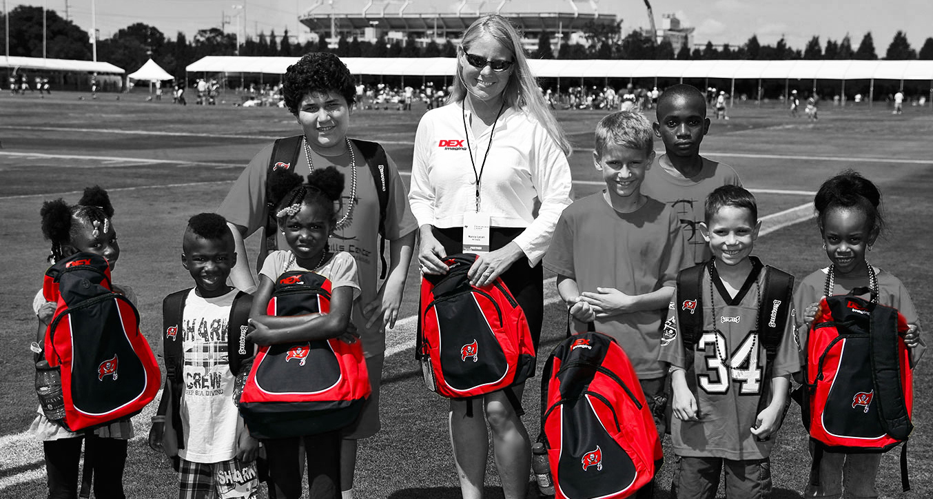 Nancy Lycan with children at One Bucs Place