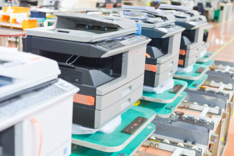 several assembled copiers on factory close up