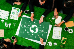 Top view of meeting with business people discussing a recycling project with sustainable recycling technology and using recyclable resource to reduce waste and pollution.