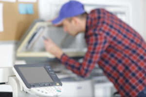 male worker checks the print quality