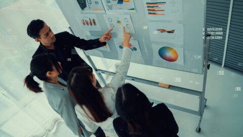 Business people in corporate staff meeting with envisional graphic . Concept of digital technology for marketing data analysis and investment decision making