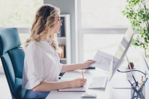 Woman at desk working on computer