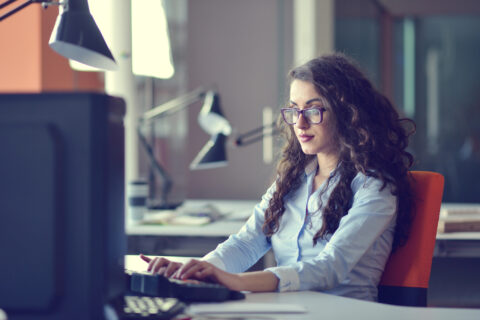 Young woman working in church office