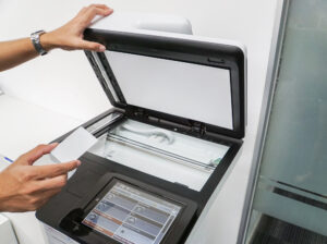 Closeup of office worker accessing a printer with a key card