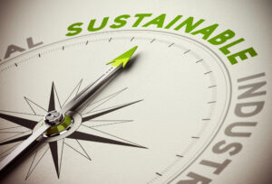 Compass needle pointing towards the word Sustainable