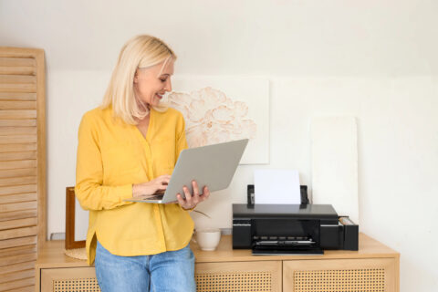 Woman printing wirelessly at home