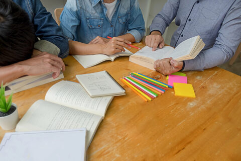 Students studying together at table