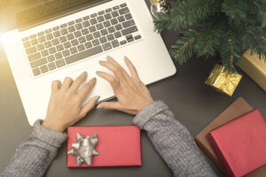 Business woman hand typing computer keyboard on desk.