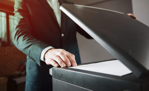 Businessman using copier