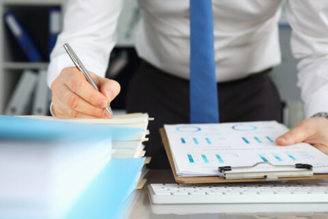 Businessman consulting lawyer, signing contract agreement.