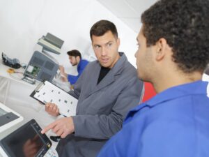 Technician discussing copier repair