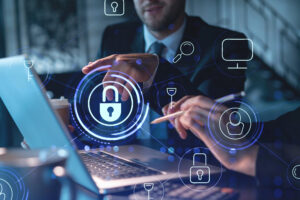 Two colleagues working together to protect clients confidential information and cyber security. IT hologram padlock icons modern office background