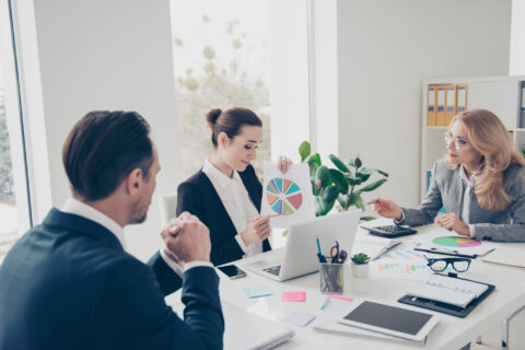 Office workers in a conference room at a business presentation